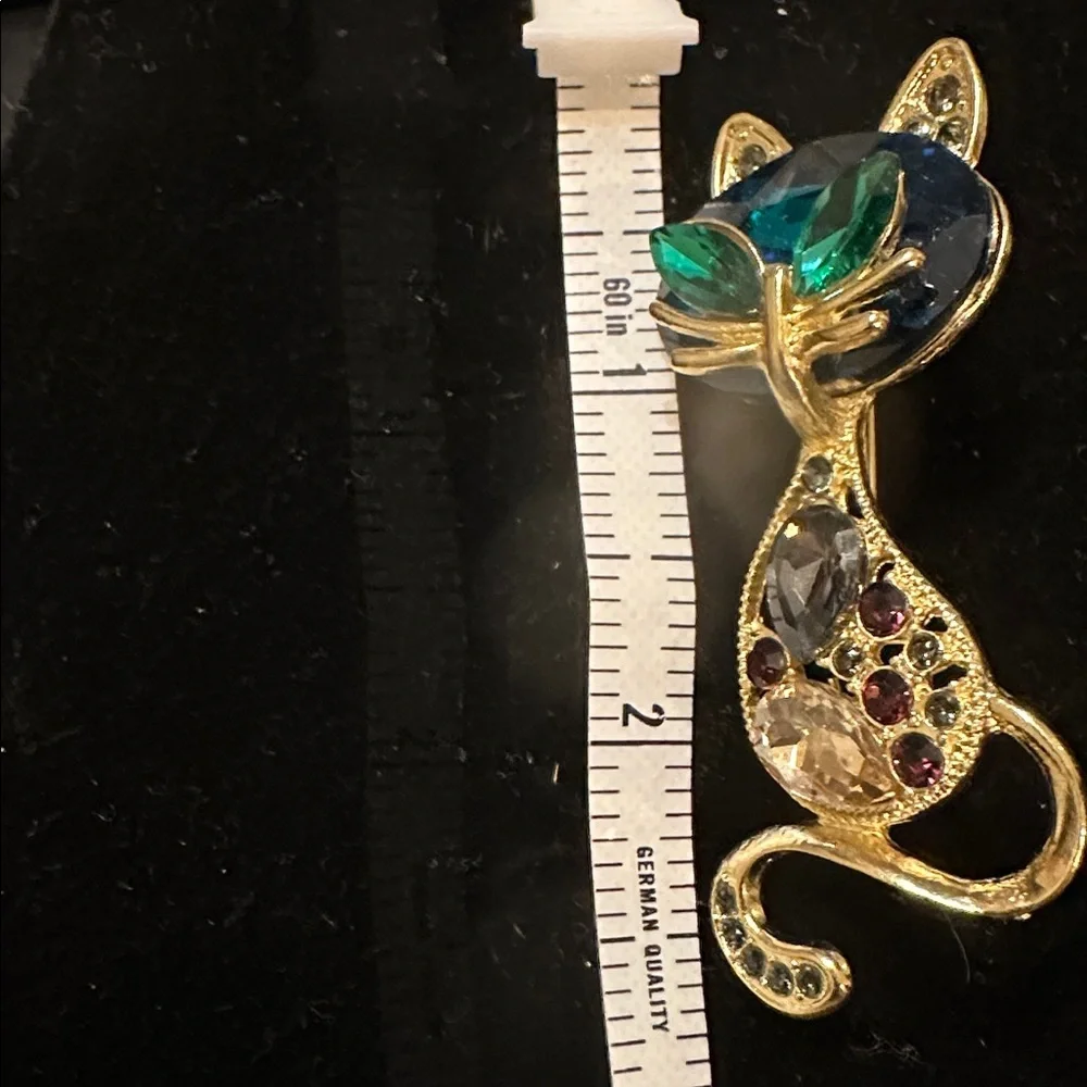 Elegant Gold Cat Brooch with Blue and Green Accents